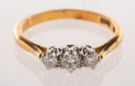 A three stone diamond ring, claw set with three brilliant-cut diamonds, diamonds approx. 0.