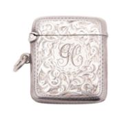 An Edwardian silver vesta case, rounded rectangular form, with bright-cut borders,