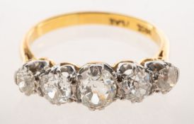 A five stone diamond ring, claw set with five graduated old min-cut diamonds, diamonds approx. 1.