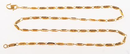 A fancy link chain, openwork links with carved decoration, hook clasp, Foreign marks to clasp,