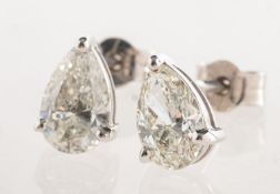 A pair of 18ct white gold pear shaped diamond stud earrings,