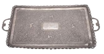 A late 19th/ early 20th century Far-Eastern two-handled silver tea tray,