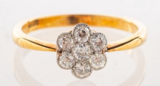A diamond daisy ring, grain set with seven old-cut diamonds, diamonds approx. 0.