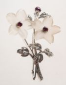 A rock crystal, ruby and diamond flower spray brooch, the flowerheads of carved rock crystal,