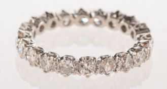 A full diamond eternity ring, claw set with twenty brilliant-cut diamonds, diamonds approx. 1.