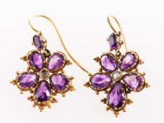 A pair of Victorian amethyst and seed pearl drop earrings, in the form of pansies,