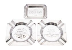 A pair of George VI silver ashtrays, canted square outline, inscribed, by Walker & Hall,
