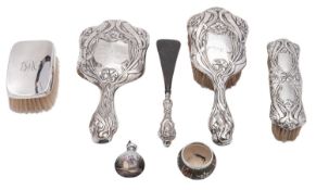 A mixed group of silver including; a Birmingham silver hair brush, clothes brush and mirror,