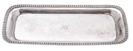 A George III silver snuffer tray, rounded rectangular outline, with an egg & dart border,