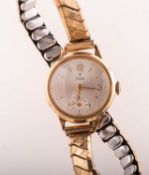 Tudor a 9K gold lady's wristwatch the round silvered dial having baton and Arabic numerals,