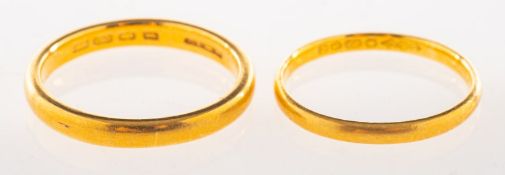 Two 22ct gold wedding bands, both UK hallmark, sizes P to P1/2 and N, total gross weight 7.0grams.