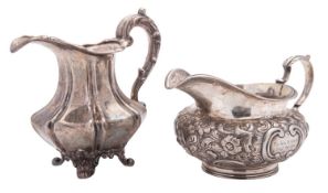 An early Victorian silver milk jug, with an octagonal body, vertical fluting and on decorative feet,