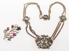 Two items of jewellery, to include a vintage flower spray brooch,