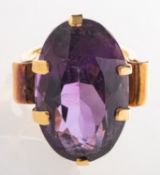 An amethyst cocktail ring, claw set with an oval-cut amethyst, measuring approx. 24.0mm x 14.