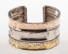 An Italian vintage tri-colour wide cuff bangle, the bangle of three conjoined concave sections,