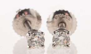 Tiffany & Co, A pair of platinum Tiffany solitaire diamond stud earrings,