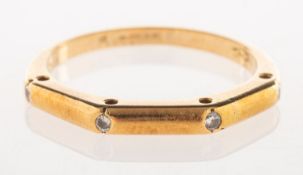 An 18ct gold diamond set band,