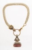 A Victorian watch chain and a carnelian fob seal,