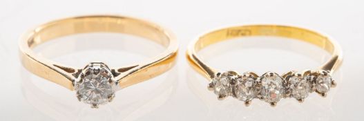 Two diamond rings, including a five stone ring,