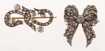 A Victorian diamond brooch and an antique paste set bow brooch,