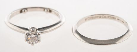 Tiffany & Co, A platinum diamond ring and a matching wedding band,