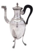 A 19th century French silver coffee pot, with an ovoid body and a wooden scroll handle,