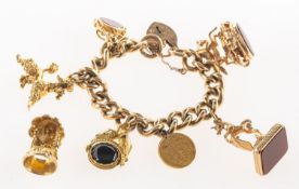 A charm bracelet with fob charms and other charms,