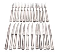 Twelve pairs of late 19th/ early 20th century German silver dessert knives and forks,