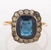 A dress ring and a pair of drop earrings,