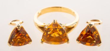 A citrine ring and a pair of matching clip on earrings,
