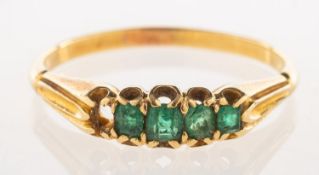A five stone emerald ring, (one emerald missing),
