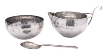 Evening class silver; a sugar bowl, milk jug & spoon,