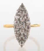 An early 20th century diamond ring, of navette shape, grain set with an array of old-cut diamonds,