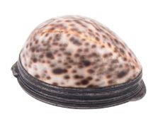 A late 18th/ early 19th century silver mounted cowrie shell snuff box, with reeded borders,
