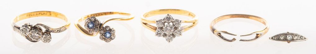A group of four rings, including an 18ct gold flowerhead ring, claw set with brilliant-cut diamonds,