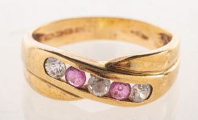 A 9ct gold crossover eternity style ring,
