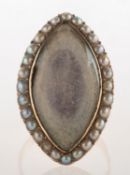 A Georgian pearl mourning ring, of navette form, with a central glass keepsake compartment,