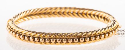 A Victorian rope twist and beadwork bangle,