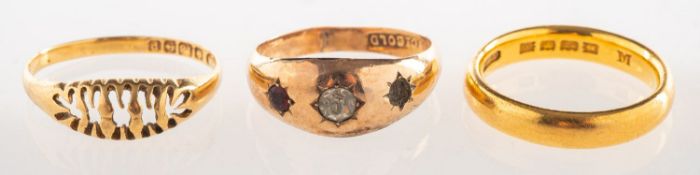 A group of three rings, including a 22ct gold wedding band, UK hallmark, 6.
