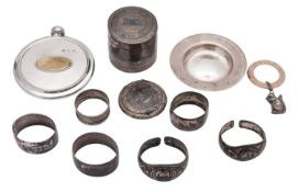 Iraqi silver; 5 napkin rings, a canister & cover and a compact, all with niello decoration,