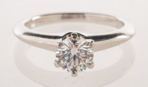 Tiffany & Co, A diamond solitaire ring, a classic Tiffany six claw setting,