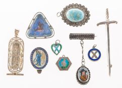 A mixed group of brooches and pendants, including a silver dagger brooch, UK import mark,