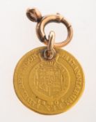 A George III 1804 1/2 guinea, with attached jump ring and bolt ring,