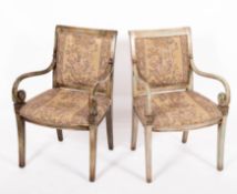 A pair of painted wood and upholstered o