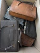 A collection of various handbags and pur