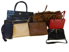 A collection of lady's handbags and purs