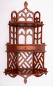 A set of mahogany hanging corner shelves