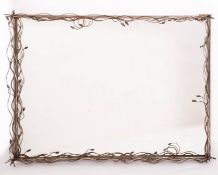 A metal framed rectangular wall mirror,