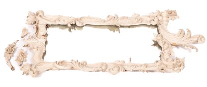 A carved wood and painted cartouche-shap