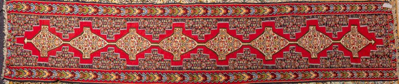 A Sehha Kelim runner, the shaded red fie